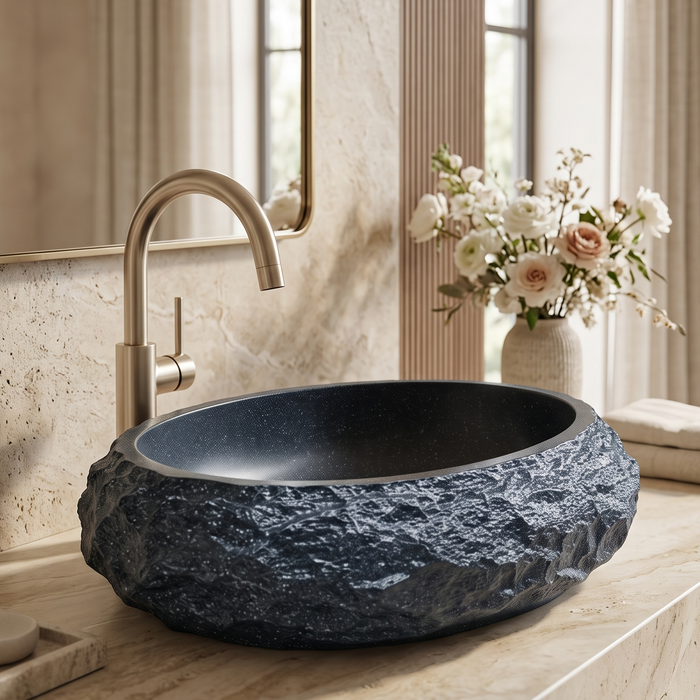 Black artificial stone oval table top wash basin 600x400x150 mm with rough natural rock textured exterior and smooth black interior, luxury designer countertop bathroom sink with modern styling and product dimensions.