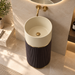 18x18x34 inch luxury freestanding pedestal wash basin with matte beige round bowl, dark brown fluted base, and elegant gold accents for modern bathrooms.