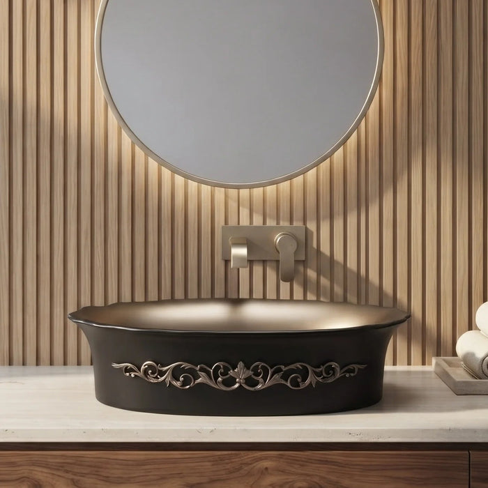 Black and champagne gold royal floral oval table top wash basin 580x370x150 mm featuring matte black exterior, metallic gold interior, antique gold ornamental scrollwork and scalloped rim for luxury bathroom countertops.