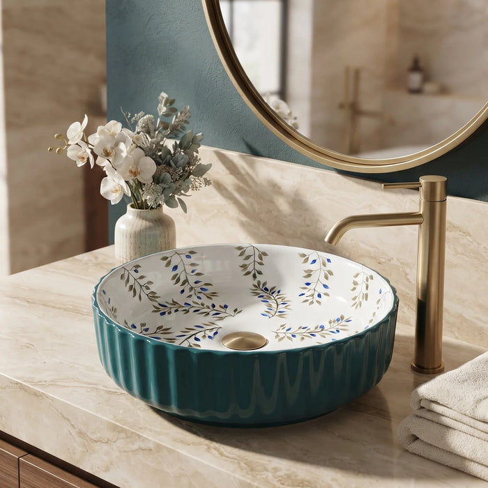 Teal green floral design round ceramic table top wash basin 400x400x120 mm featuring glossy ribbed exterior, white interior with elegant blue and olive botanical leaf patterns, luxury designer countertop bathroom sink.