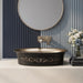 Black and champagne gold royal floral oval table top wash basin 580x370x150 mm featuring matte black exterior, metallic gold interior, antique gold ornamental scrollwork and scalloped rim for luxury bathroom countertops.