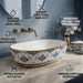 Blue and gold floral design oval table top wash basin 560x385x150 mm featuring glossy white interior, intricate ornamental blue patterns, elegant gold rim and base accents, luxury designer countertop bathroom sink.
