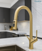 Gold kitchen faucet on a modern kitchen counter with 'Bassino' branding.