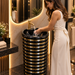 Black and gold luxury floor standing pedestal wash basin with glossy cylindrical design, horizontal gold detailing and 440 × 440 × 820 mm size for modern bathrooms.