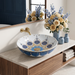 Decorative round table top wash basin 400 × 400 × 125 mm with glossy white finish, intricate blue and gold pattern, designed for luxury modern bathrooms.