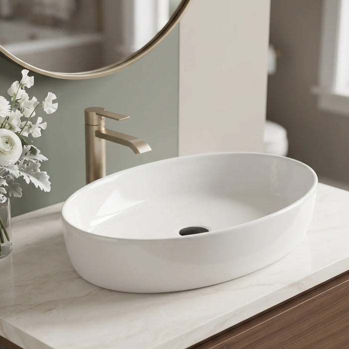 Glossy white oval table top wash basin measuring 550 × 410 × 140 mm, with a smooth curved bowl, styled on a bathroom vanity counter.