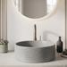 Grey artificial stone round table top wash basin with textured exterior, smooth interior and 400x400x160 mm dimensions for modern luxury bathrooms.