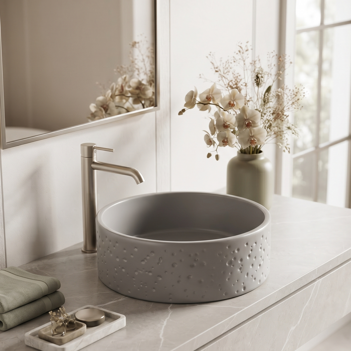 Grey artificial stone round table top wash basin with textured exterior, smooth interior and 400x400x160 mm dimensions for modern luxury bathrooms.