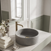 Grey artificial stone round table top wash basin with textured exterior, smooth interior and 400x400x160 mm dimensions for modern luxury bathrooms.