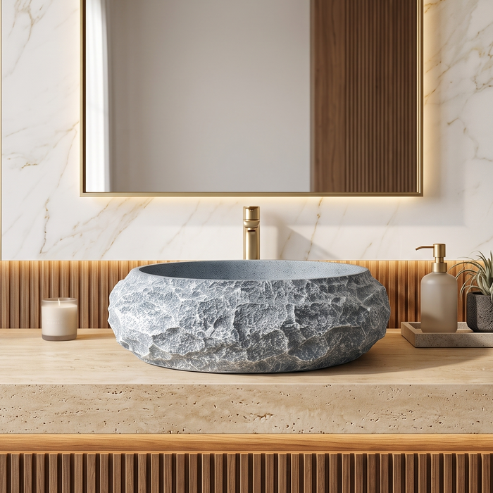 Grey artificial stone table top wash basin with matte speckled interior, oval shape and natural rock-textured exterior, 560 × 480 × 135 mm.