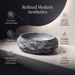 Grey artificial stone table top wash basin with matte speckled interior, oval shape and natural rock-textured exterior, 560 × 480 × 135 mm.