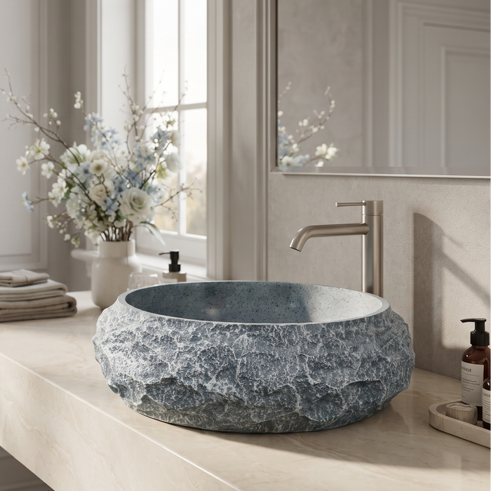 Grey artificial stone table top wash basin with matte speckled interior, oval shape and natural rock-textured exterior, 560 × 480 × 135 mm.