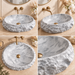 Grey oval artificial stone tabletop wash basin with a matte finish, rugged textured exterior and smooth patterned interior, measuring 500 × 400 × 150 mm.