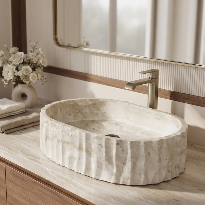 Ivory white marble finish oval table top wash basin with beige veining, vertical fluted exterior and 20 inch countertop design for modern luxury bathrooms.