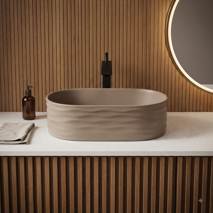 Taupe tabletop wash basin with a matte finish and wave-textured exterior, shown from multiple angles in a modern bathroom setting.