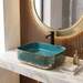 Teal blue and gold rectangular table top wash basin 400 × 300 × 140 mm with glossy finish and ornate floral pattern, designed for modern luxury bathrooms.