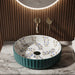 Teal green floral design round ceramic table top wash basin 400x400x120 mm featuring glossy ribbed exterior, white interior with elegant blue and olive botanical leaf patterns, luxury designer countertop bathroom sink.