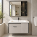 Wall-mounted bathroom vanity set with white basin, light grey cabinet, fluted door and dark-framed mirror cabinet.