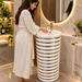 White and gold ceramic pedestal wash basin with glossy finish, sculpted cylindrical design and 440 × 440 × 820 mm size for modern luxury bathrooms.