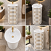 White and gold ceramic pedestal wash basin with glossy finish, sculpted cylindrical design and 440 × 440 × 820 mm size for modern luxury bathrooms.