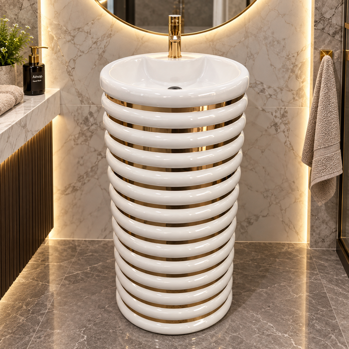 White and gold ceramic pedestal wash basin with glossy finish, sculpted cylindrical design and 440 × 440 × 820 mm size for modern luxury bathrooms.