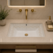 White and gold designer ceramic under counter wash basin with glossy finish, 520 × 380 × 190 mm rectangular undermount bathroom basin with decorative gold pattern.