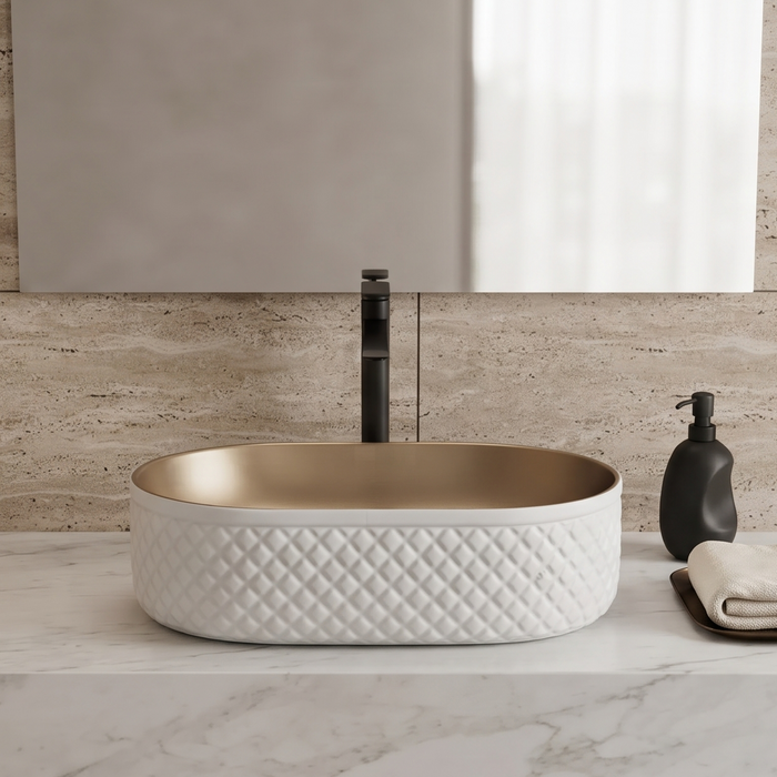 White and gold oval table top wash basin with diamond-textured exterior, measuring 500 × 360 × 150 mm, styled on a bathroom vanity counter.
