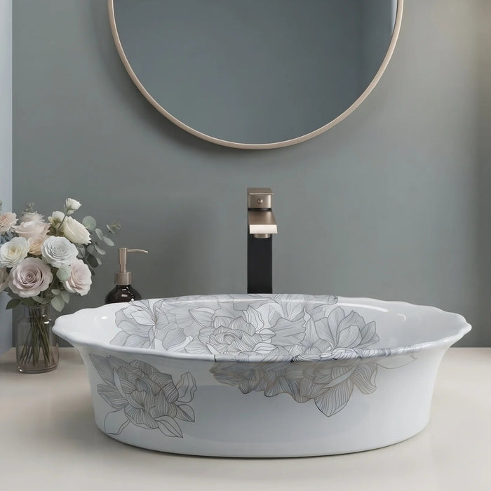 White floral design oval table top wash basin 580x370x150 mm featuring elegant grey botanical line art, glossy white appearance, scalloped curved rim and decorative floral patterns for luxury bathroom countertops.