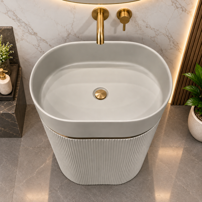 White matte artificial stone freestanding pedestal wash basin with oval bowl, vertical fluted design and gold accent, 600×380×860 mm luxury bathroom sink.