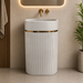 White matte artificial stone freestanding pedestal wash basin with oval bowl, vertical fluted design and gold accent, 600×380×860 mm luxury bathroom sink.