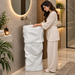 White sculptural freestanding pedestal wash basin 17.7 x 17.7 x 33.9 inch with irregular textured design for modern luxury bathroom interior.