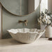 White seashell design table top wash basin 470x390x170 mm featuring elegant scalloped wavy edges, vertically ribbed shell texture and natural speckled finish, luxury designer countertop bathroom sink for modern bathrooms.