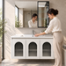 White wall-mounted bathroom vanity set with three arched fluted glass doors, integrated ceramic basin and mirror storage cabinet, 1000 mm wide.